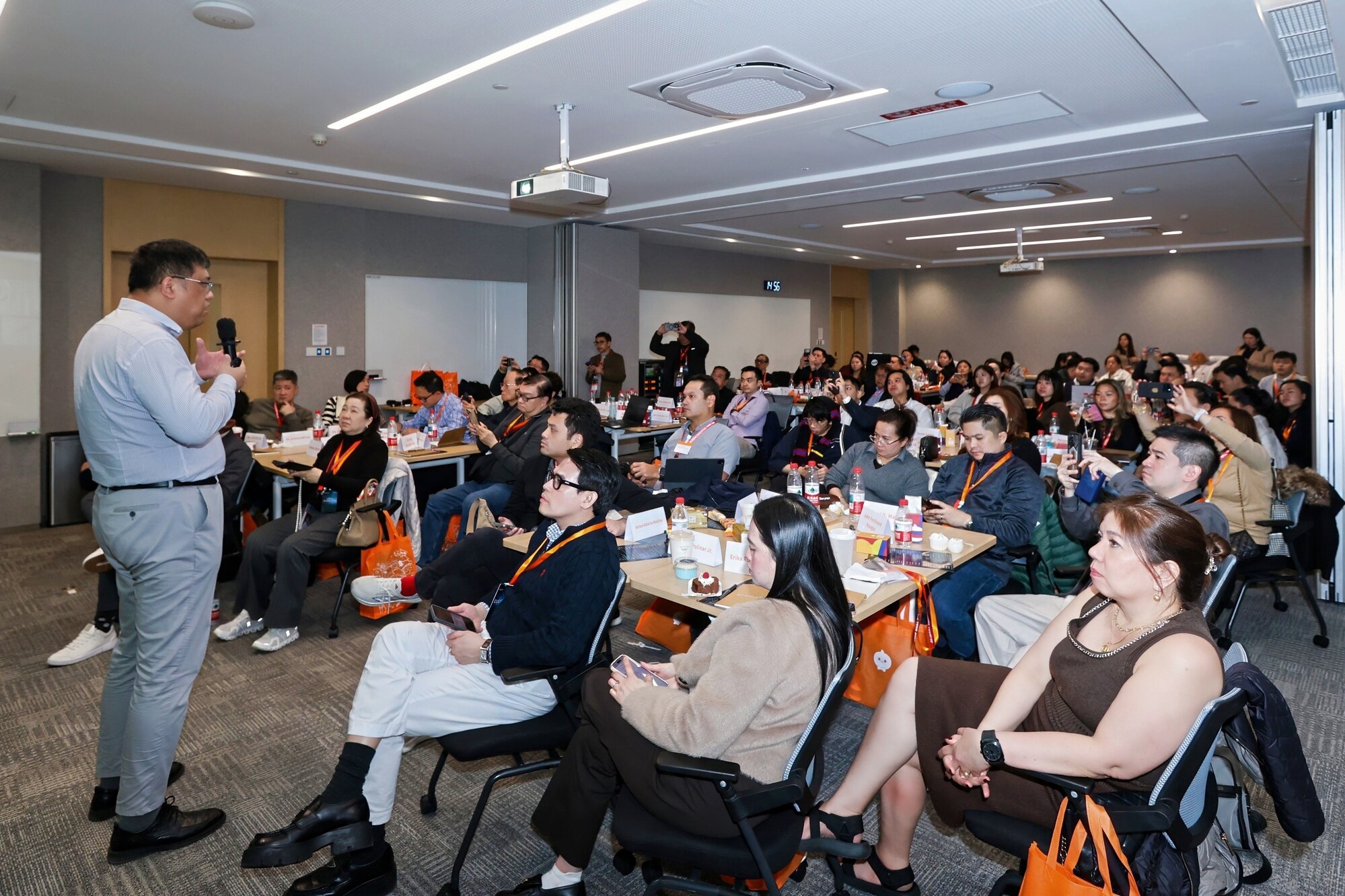 Business leaders attending an AI Transformation Bootcamp classroom session